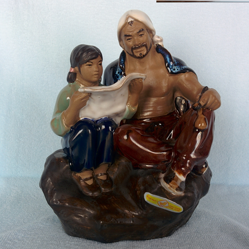 Laughing Buddha - Man and Girl Reading