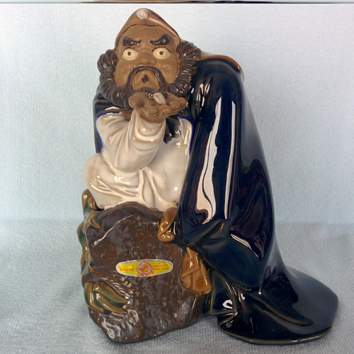 Laughing Buddha - Man with Knife
