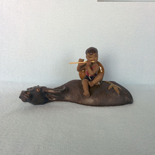 Laughing Buddha - Boy on a Buffalo Statue